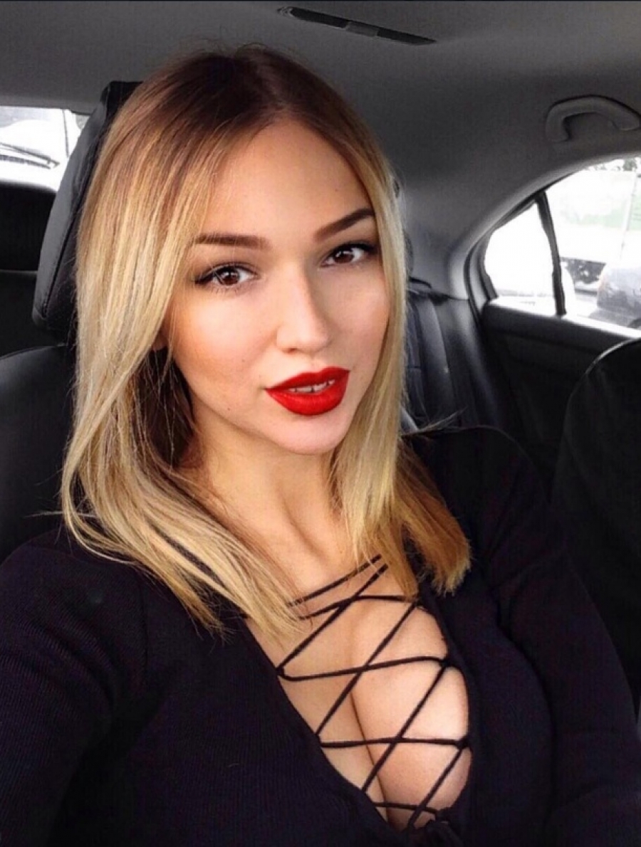 Busty blonde in the car